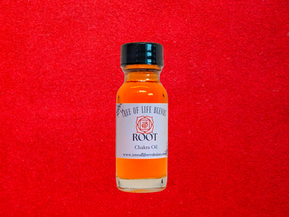 Root chakra oil from Tree of Life Evolution on red background