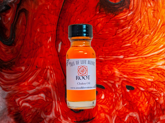 Root chakra oil from Tree of Life Evolution on red swirl background