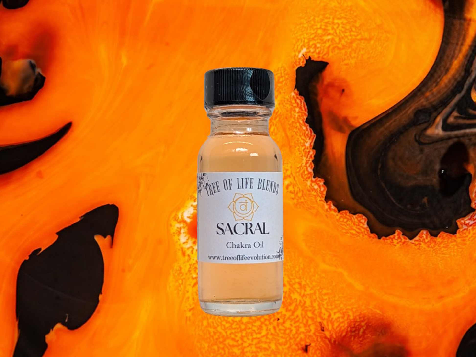 Sacral chakra oil from Tree of Life Evolution with orange swirl background