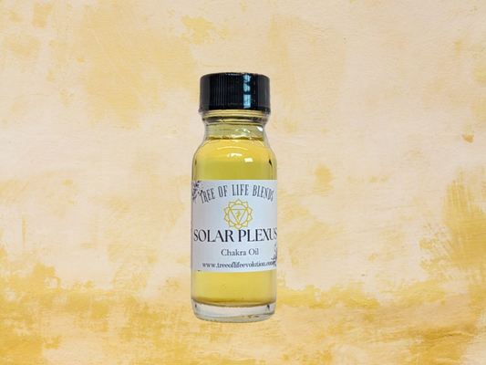 Solar Plexus chakra oil from Tree of Life on yellow background