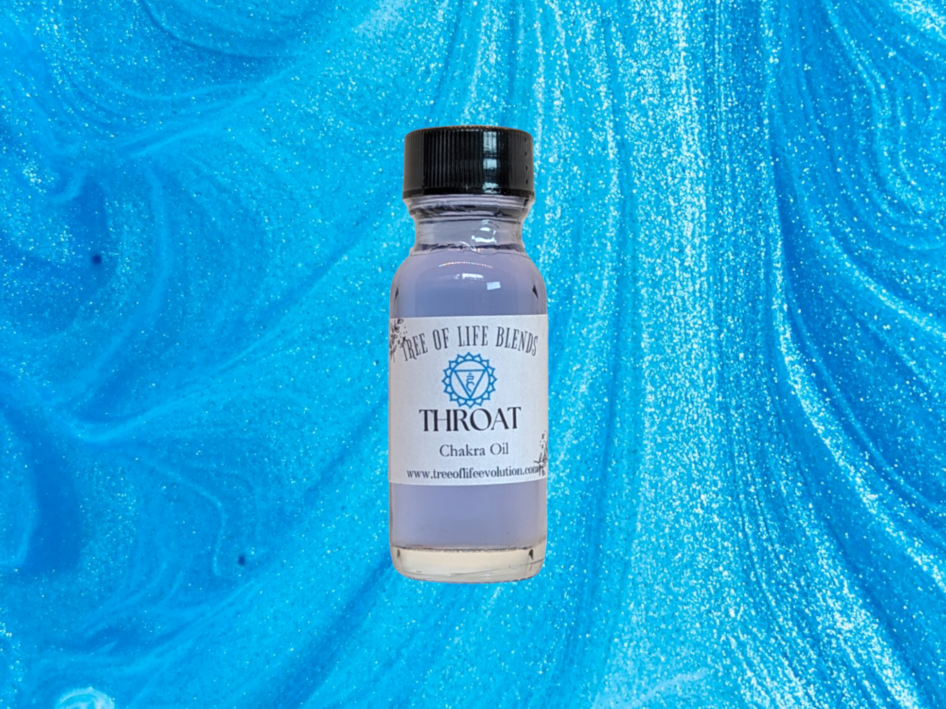 Throat chakra oil from Tree of Life Evolution on blue background